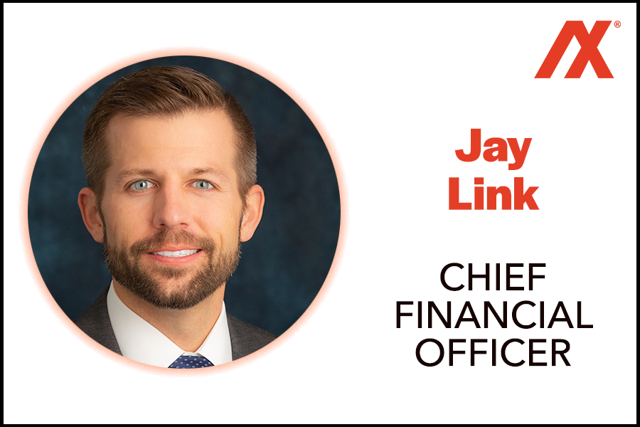 Professional headshot of Jay Link, Chief Financial Officer, featuring a well-groomed man with a beard, wearing a suit and tie, against a dark blue background. The image includes the AX logo.