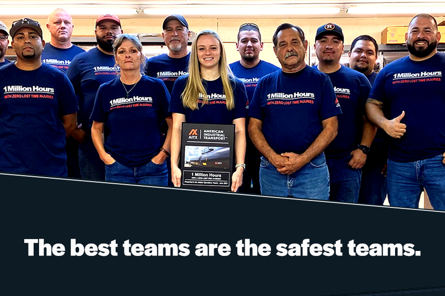Group photo of a safety-conscious team from American Industrial Transport celebrating achieving 1 million hours without lost-time injuries, showcasing their commitment to workplace safety.